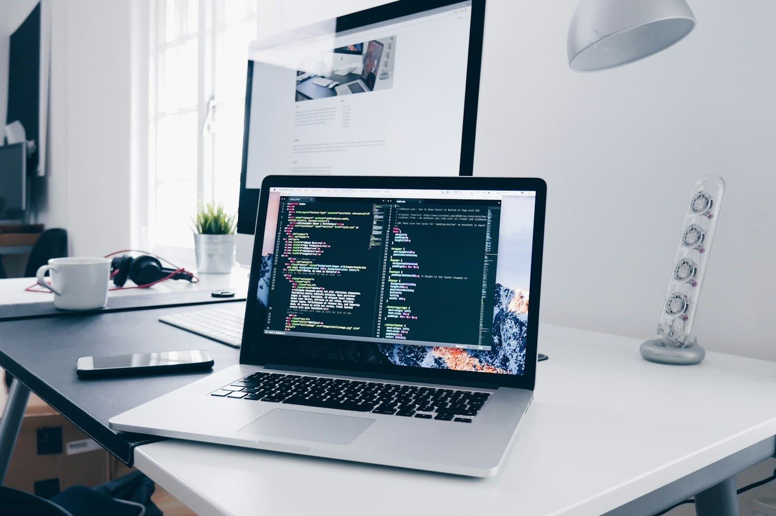 Website development workspace with screen and code context.
