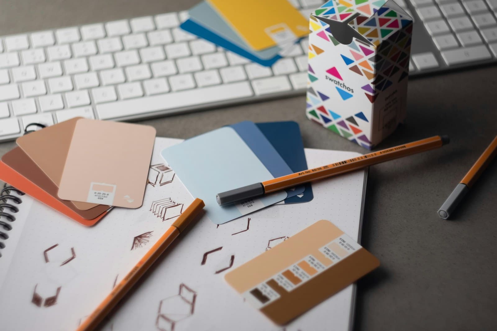 Product design workspace with interface layouts, color cards, sketches, and tools.